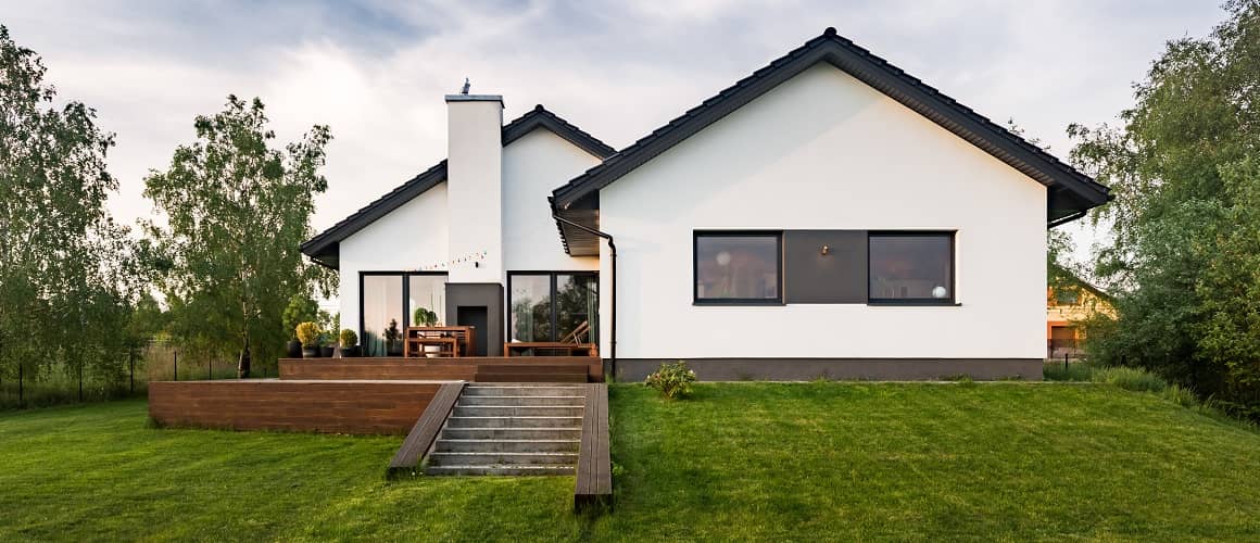 https://www.rocketmortgage.com/resources-cmsassets/RocketMortgage.com/Article_Images/Large_Images/Stock-White-Minimalistic-House-With-Black-Roof-AdobeStock163839984.jpg